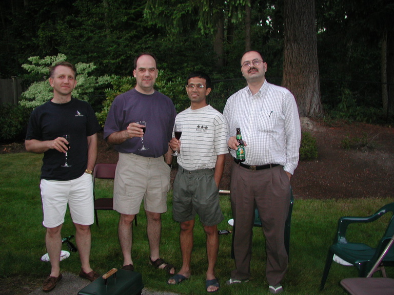 Four former grad students posing for a photo
